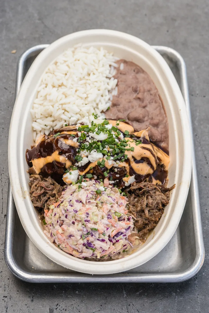Sliced smoked brisket platter with sauce at Park 101 Carlsbad