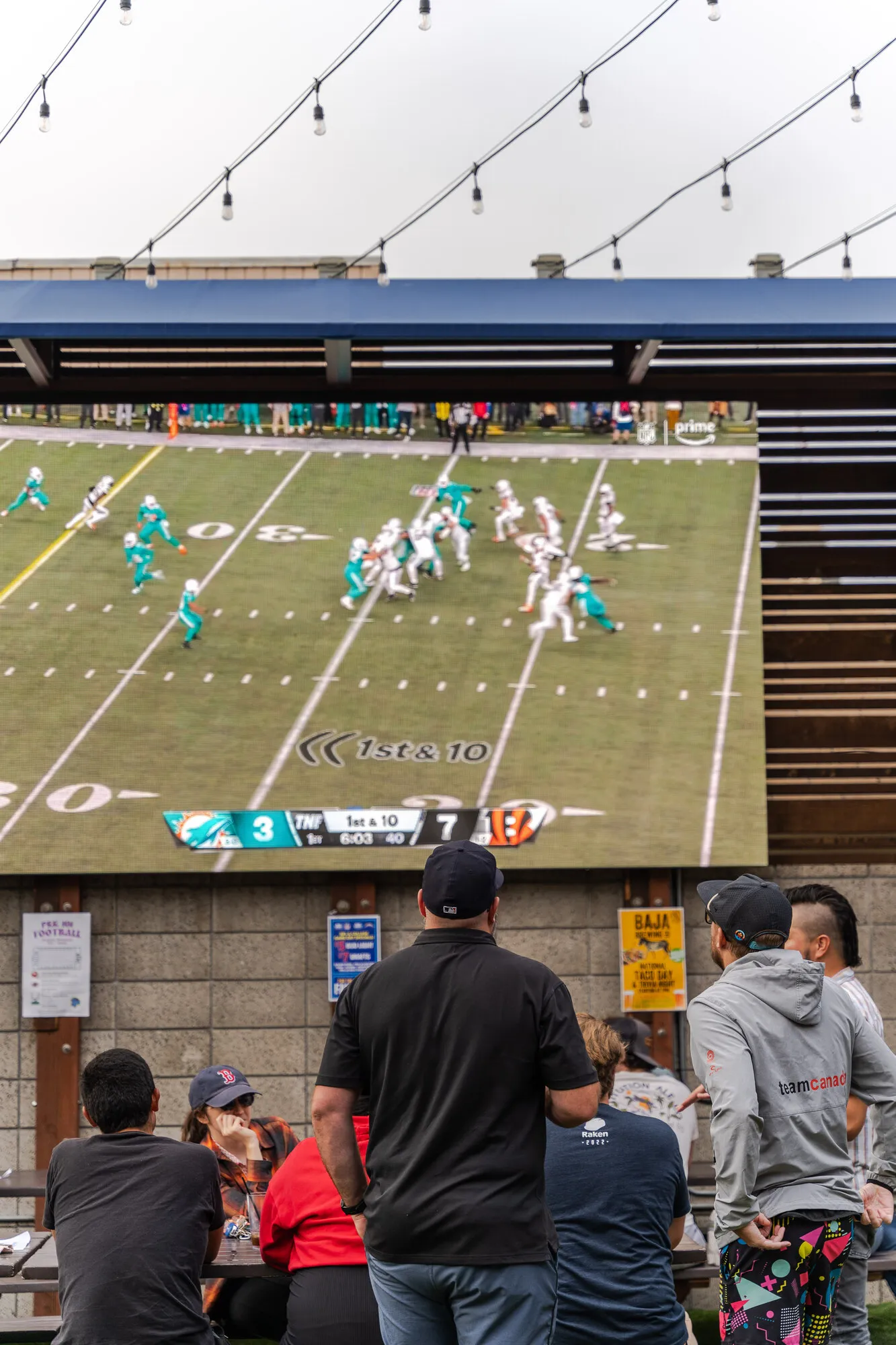 Crowd watching a big screen at Park 101 Carlsbad