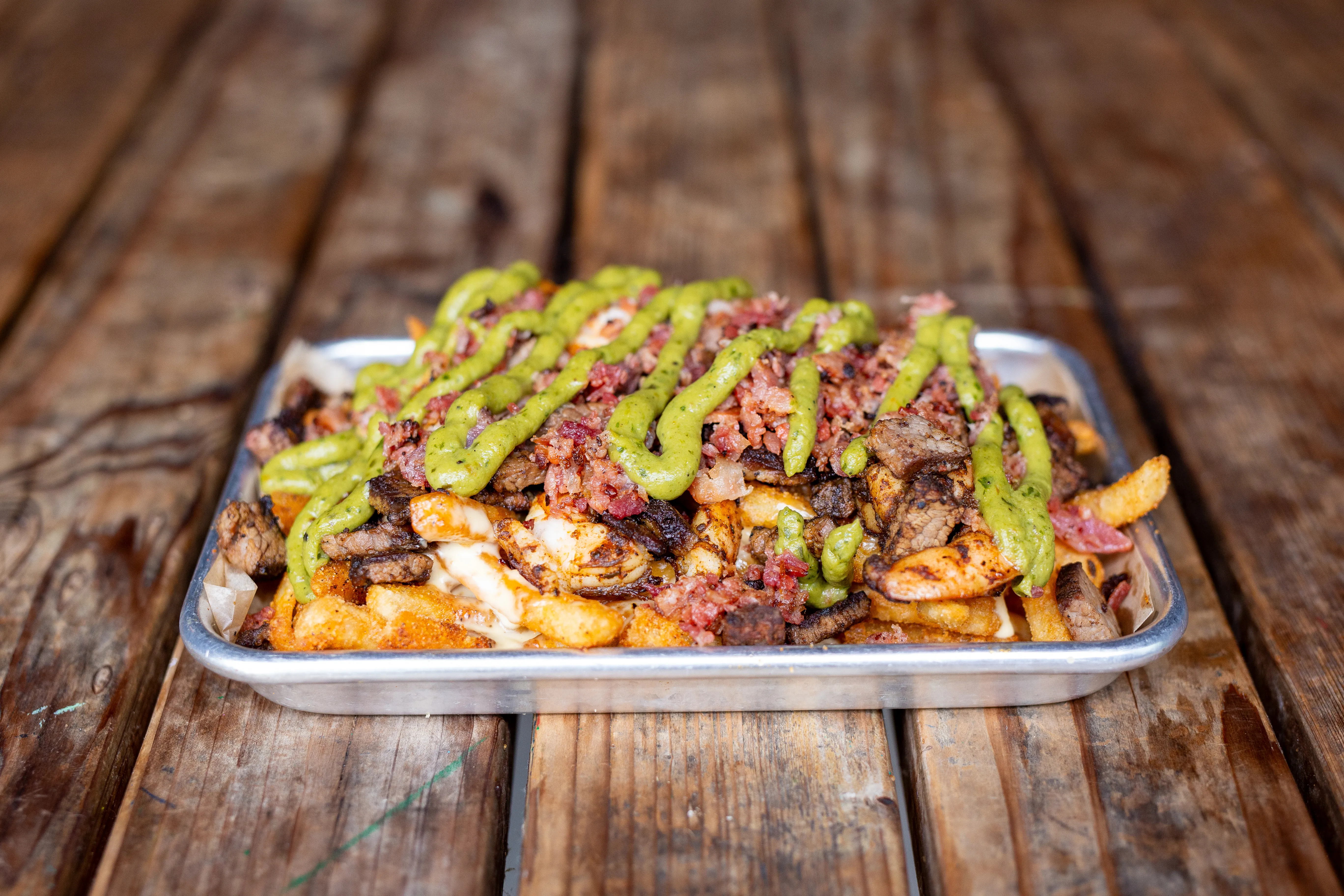 Surf and turf loaded fries with smoked meat and shrimp at Park 101 Carlsbad