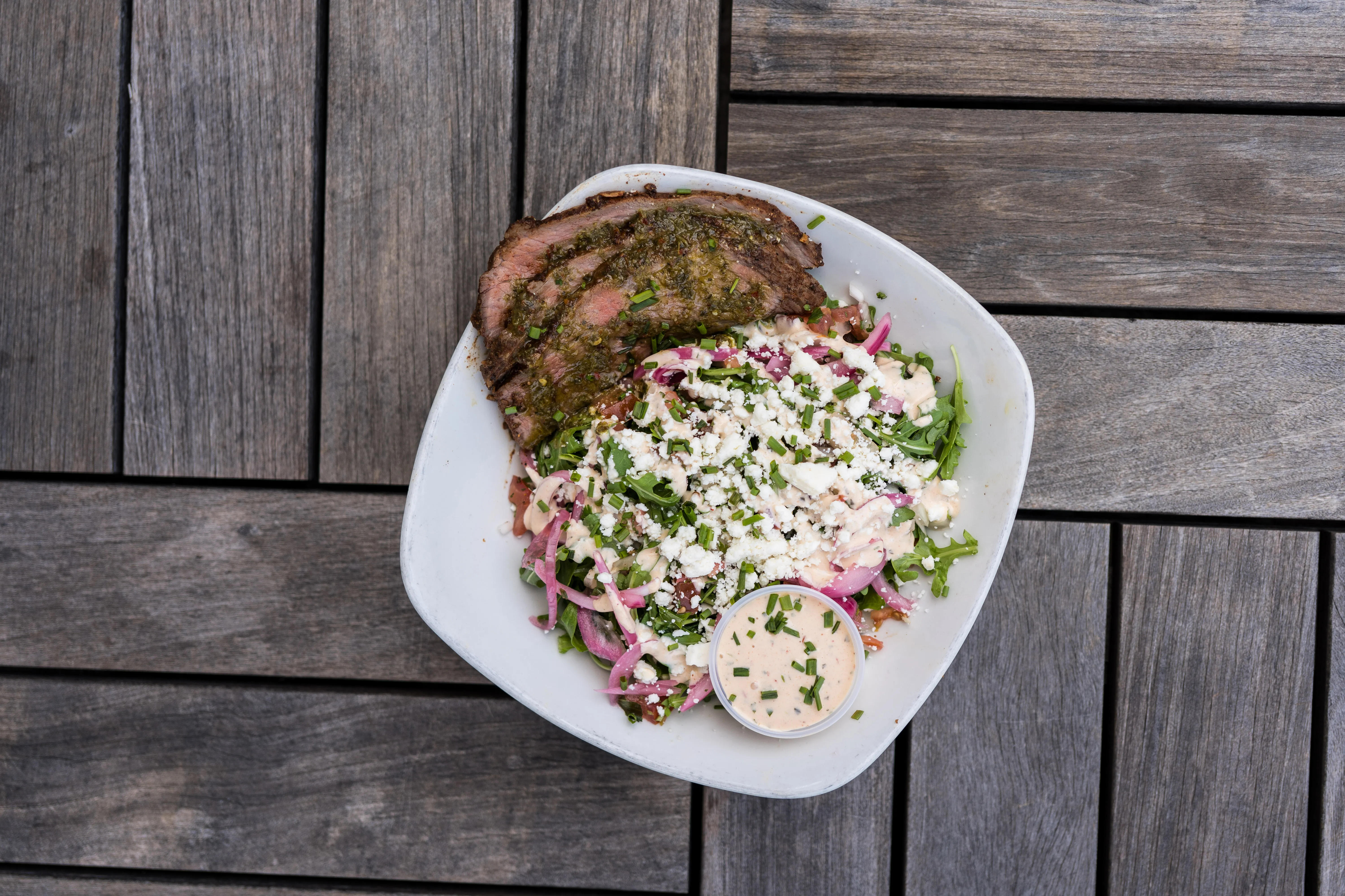 Tri-Tip x Arugula salad with pickled onion and cotija at Park 101 Carlsbad