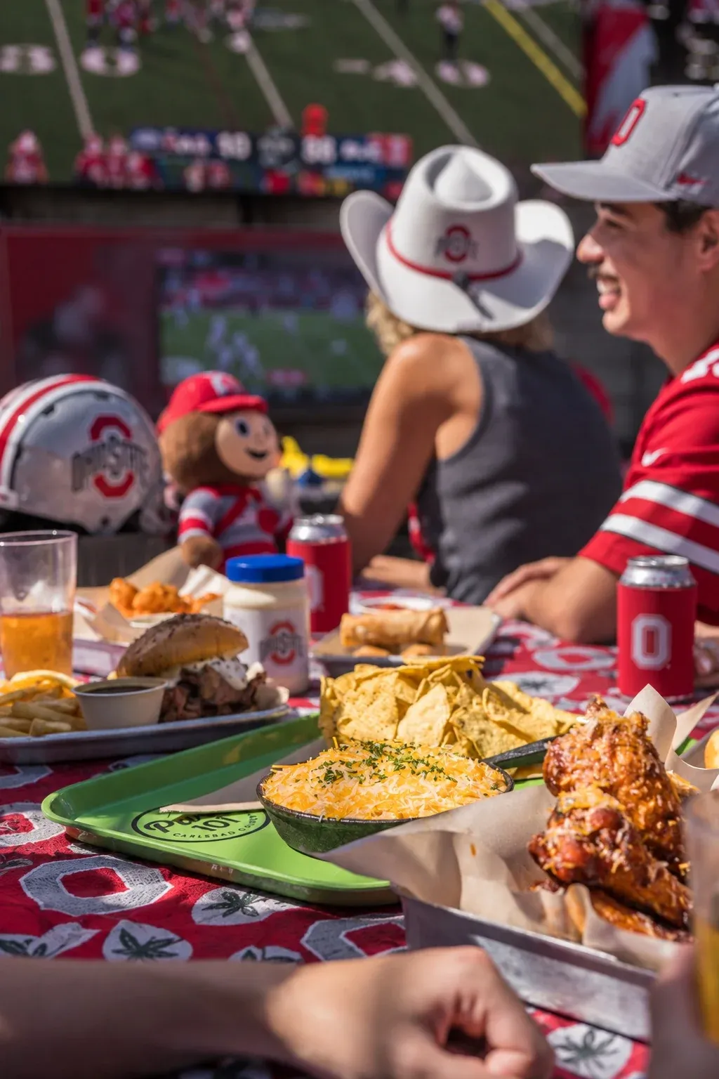 Ohio State Buckeyes fans with game day food and drinks at Park 101 in Carlsbad